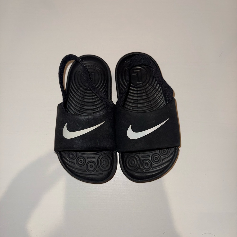 Nike Kids Black Slide Sandals with White Swoosh and Back Strap